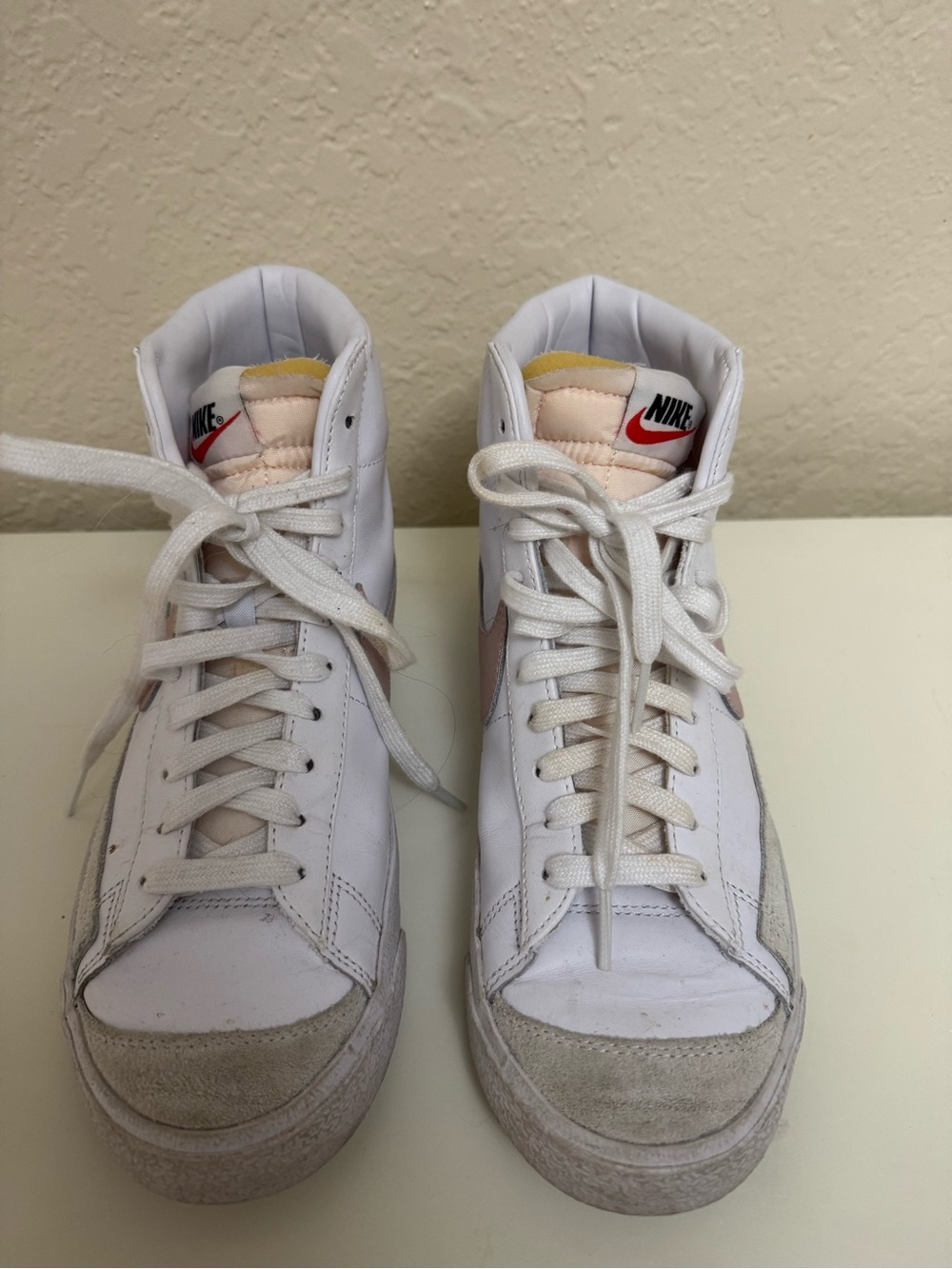 Nike White High-Top Sneakers with Pale Pink Details